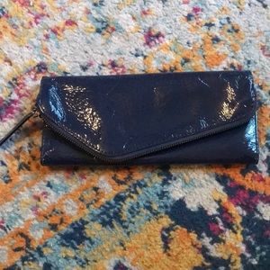 In like new condition, Hobo International Navy patten leather wallet.